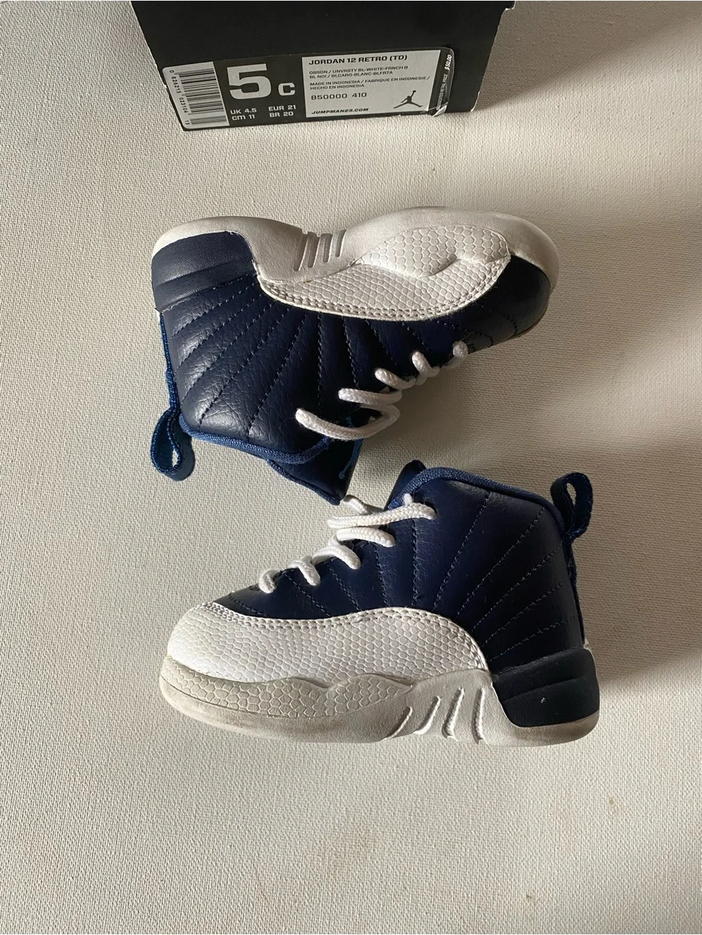 Nike Kids Navy and White Jordan 12’s